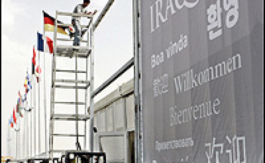 Workers prepare for the 'Rebuild Iraq 2007' conference in Amman, Jordan, held earlier in May.