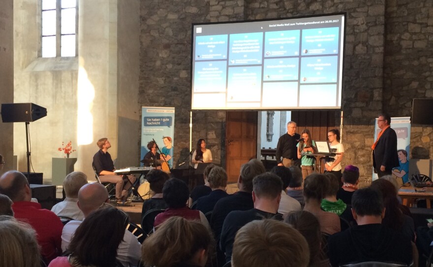 Worshipers at the Walloon Reformed Church of St. Augustine in Magdeburg, Germany, participate in a service where the congregation is encouraged to tweet about the liturgy and share their prayers online.