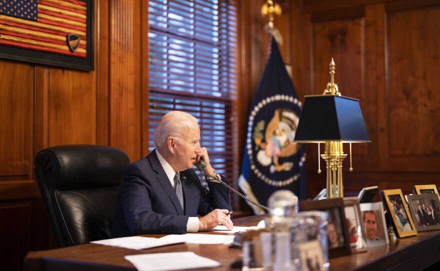 In this image provided by the White House, President Biden speaks with Russian President Vladimir Putin on the phone from his private residence in Wilmington, Del., on Thursday.
