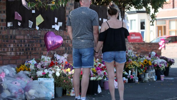 FILE - Floral tributes are left at the site in Southport, England, Aug. 11, 2024 after three young girls were killed in a knife attack at a Taylor Swift-themed holiday club.
