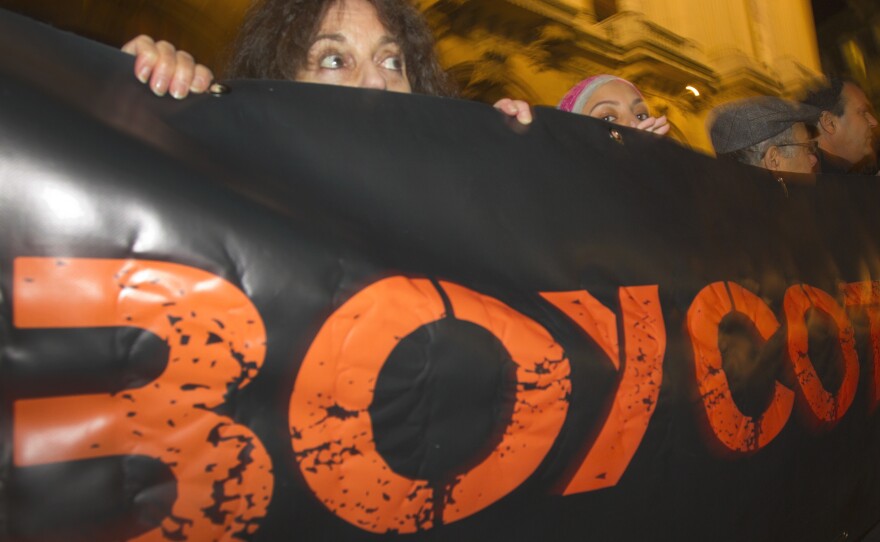 French demonstrators and supporters of Palestinians call for a boycott during a 2012 demonstration in Paris.