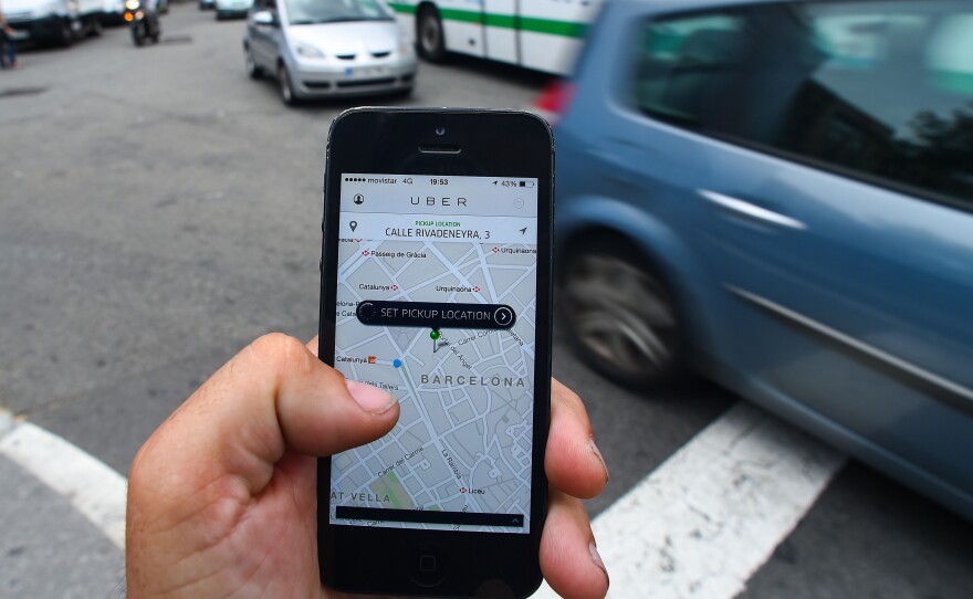 In Spain, taxi licenses can cost upwards of $150,000. Drivers pay it off like a mortgage, over their career. Many worry their investment will be worthless if private citizens can pick up fares with the Uber smartphone app.