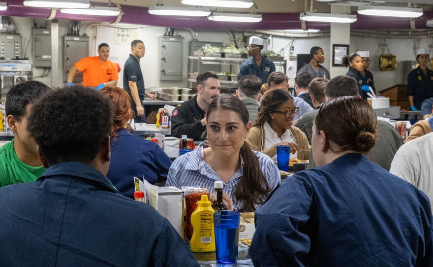 Photo of Rep. Sara Jacobs sitting for a meal with sailors on the mess decks of the USS Abraham Lincoln Sunday, Sept. 27, 2026.