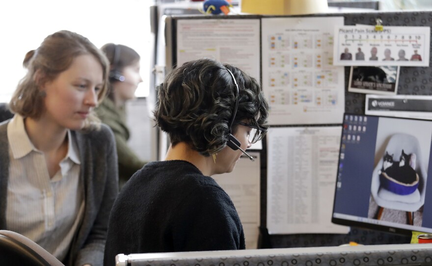 A contact tracer checks-in via phone with a patient self-quarantined at home in February.
