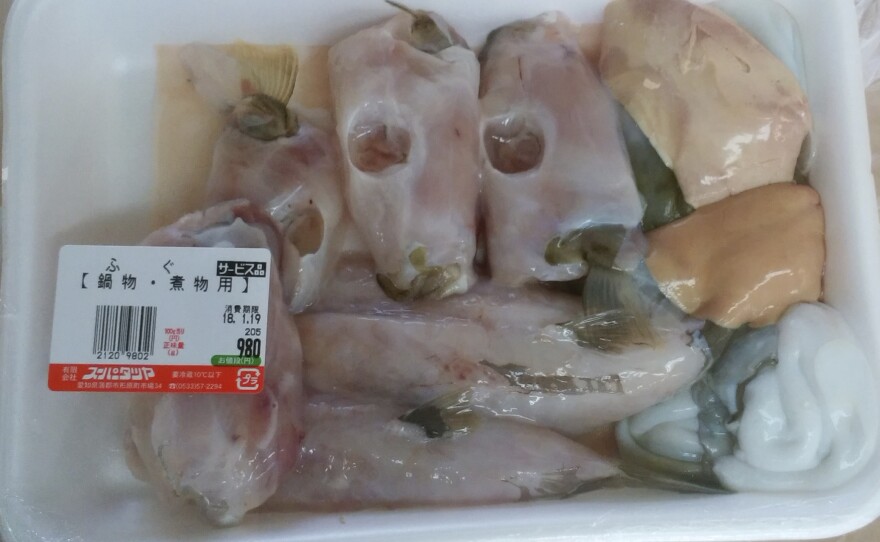 A photo provided by Aichi Prefectural Government's Department of Health and Public Welfare shows a package containing a potentially deadly blowfish liver, top right, on Monday.