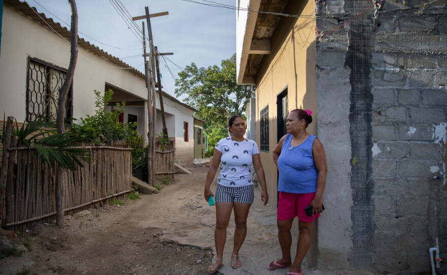 July (left) recalls gathering water from a nearby creek when she was a child, along with her mother, Ana (right). July says the access to water isn't much better since water delivery in their section of La Paz was cut from twice a month to once a month.