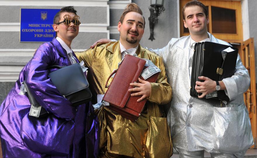 Fashion designer Oleksiy Zalevsky created "uniforms for the corrupt," during a symbolic fashion show in front of Ukraine's Health Protection Ministry in Kiev in 2009.