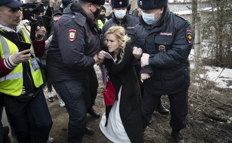 Police officers Tuesday detain Alliance of Doctors union leader Dr<strong>. </strong>Anastasia Vasilyeva outside a prison colony in Pokrov, Russia, east of Moscow. A group of doctors gathered at the prison colony where opposition leader Alexei Navalny is being held.