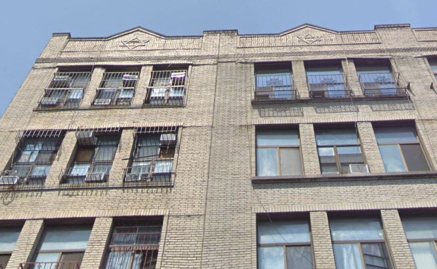 The exterior of the condo building at 165 Henry St. in Manhattan's Lower East Side hints at the split-level apartments inside, as air conditioners (upper left) are positioned at both the upper and lower windows of the top two floors.