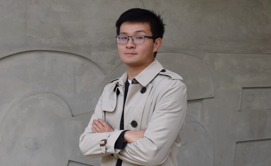Alex Liu stands next to UC San Diego's science and engineering building in this undated photo. Liu is a computer science Ph.D. student who specializes in cyber security.