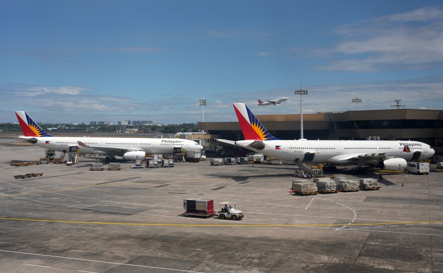 Philippine airlines parked at Manila's international airport, Philippines on Wednesday, March 25, 2026.