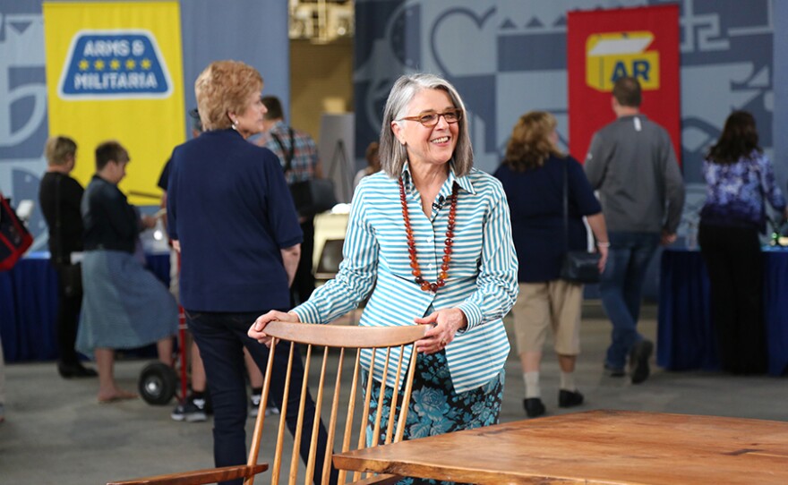 Karen Keane appraises a George and Mira Nakashima table and chairs