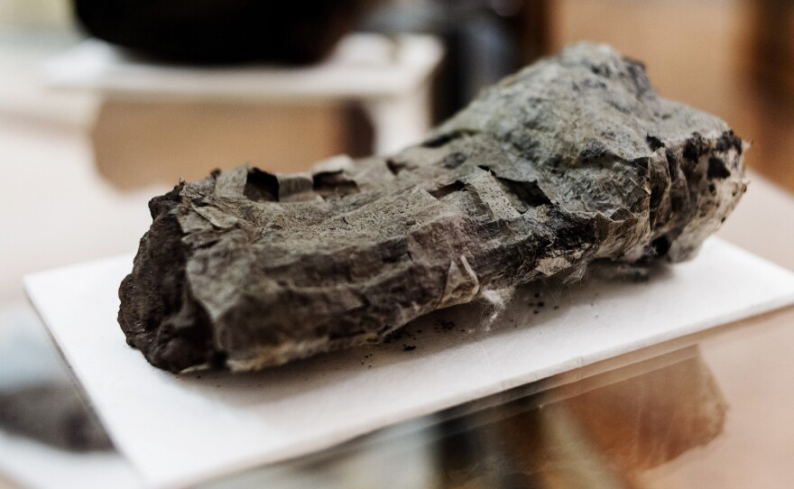 The ancient scrolls look and feel more like blocks of charcoal. A new technique gives a peek inside.