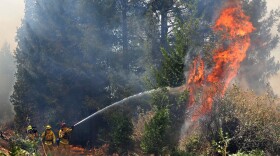 Firefighters battle the flames from the King fire near Fresh Pond, which is east of Sacramento, Sept. 17, 2014.