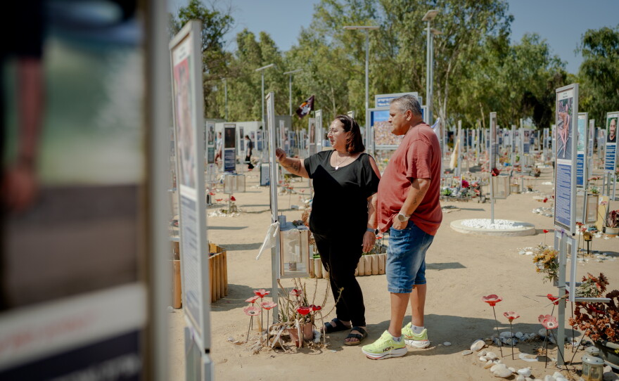Meir and Kati Zohar stand together at the memorial marker dedicated to their daughter, Bar Zohar, at the Nova festival memorial site in southern Israel, on Sept. 24, 2026. Their daughter was among the victims killed on Oct. 7, 2023.
