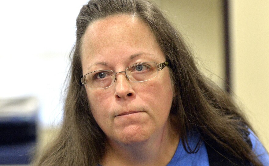 Rowan County Clerk Kim Davis listens to a customer following her office's refusal to issue marriage licenses at the Rowan County Courthouse on Tuesday.