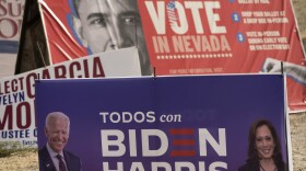 A campaign sign supporting Democratic presidential candidate former Vice President Joe Biden and running mate Kamala Harris stands in front of a vote sign showing former President Barack Obama near the Clark County Election Department in North Las Vegas, Nev., Friday, Nov. 6, 2020.