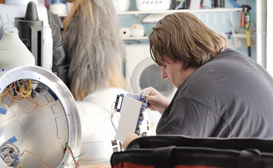 Cory Hall working on the electronics for an R2 unit. July 11, 2023