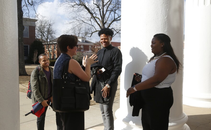 Johnson talks with his friends on campus.