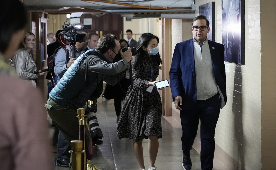 Rep. George Santos walks through the hallways after a caucus meeting at the U.S. Capitol on Jan. 10, 2023.