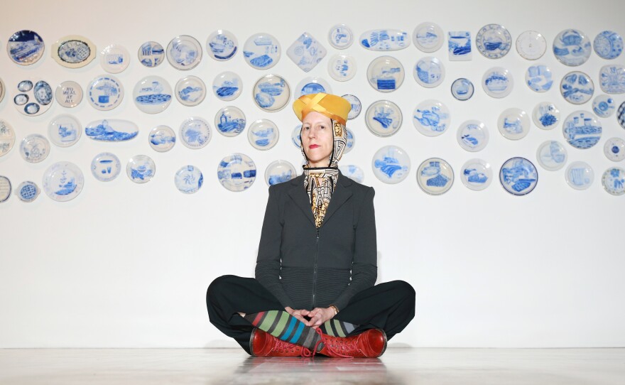 Artist Julie Green in front of a cluster of "The Last Supper" plates at the Mary and Leigh Block Museum of Art on the Northwestern University campus in Evanston, Ill., May 2015.