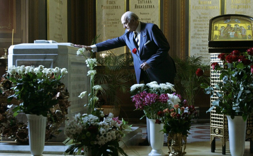 Dmitry Romanov, a descendant of the tsar's family, pays his respects in 2008 at the tomb holding the remains of Nicholas II, Alexandra and their three daughters in St. Petersburg's St. Peter and Paul Cathedral.