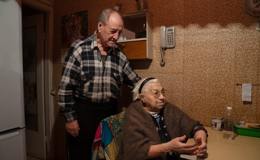 Pavlo Komodovskyi and his wife, Tamara Vasylenko, who had a stroke this year, in their kitchen in their apartment in Kyiv.