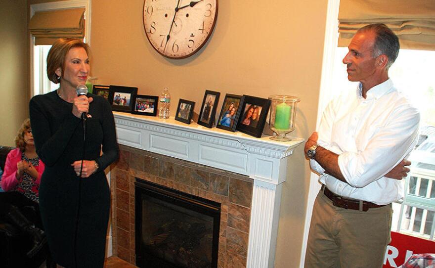 Carly Fiorina speaks at a house party event at the home of Rich Ashooh (right) in Bedford, N.H. in November. "Less is more with some of these house parties." Ashooh said.