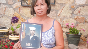 Ruth Rivas with a photo of her son Adam Hernandez