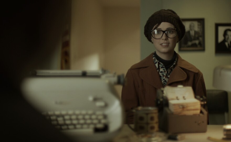 Bonnie Raines (played by Lauren A. Kennedy) cases the FBI office.