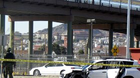 A Mexican soldier patrols the scene where three U.S. consulate staffers were killed Saturday in Ciudad Juarez, across from El Paso, Texas.
