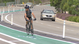 A cyclist rides in a new bike lane. 