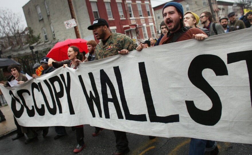 Occupy Wall Street protesters march through in an impoverished community in Brooklyn to protest home foreclosures. Many see the movement's dynamic strategies and aims as key to its success.