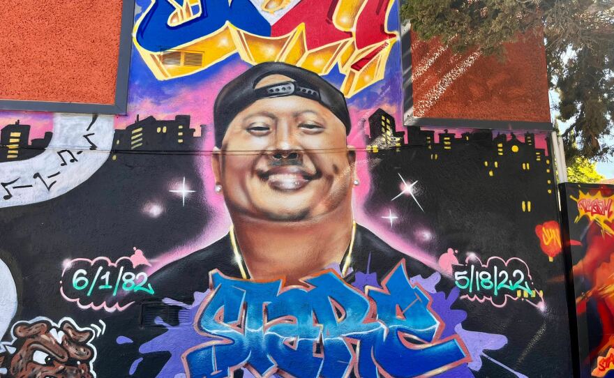 A street mural honors the life of Artgel "Jun" Anabo Jr. near where was fatally shot just outside his Lucky Three Seven restaurant in East Oakland, Calif., in May 2022. Like more than 60% of the murders in the city, his killing remains unsolved.