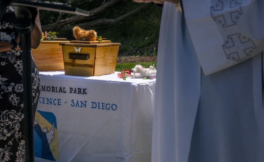 The coffins of two abandoned children at their funeral organized by volunteers from the Garden of Innocence, San Diego, June 17, 2023.<br/>