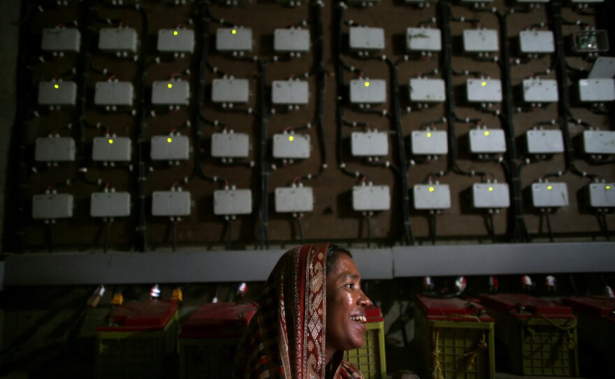 Minoti Aulia, 40, runs her village's committee of women — and the solar power station. With electricity, "everything has changed," she says. "From cooking our meals to children studying for long hours to not feeling scared — the fear of darkness. And women have now got engaged in a lot of other work, which earlier they were not able to because there was no light."