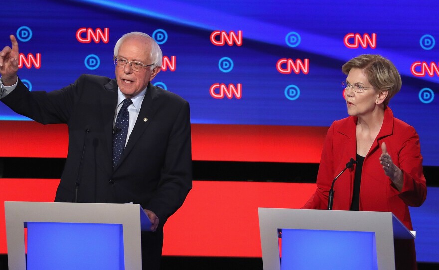 Democratic presidential candidates Bernie Sanders and Elizabeth Warren say corporate America has put profits before workers by shifting jobs to other countries.