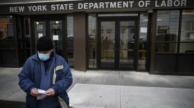 Visitors to the Department of Labor are turned away at the door by personnel due to closures over coronavirus concerns, Wednesday, March 18, 2020, in New York. 