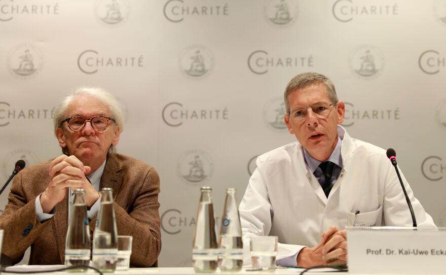 The CEO of Berlin's Charite Hospital, Karl Max Einhaeupl (left), and leading doctor Kai-Uwe Eckardt discuss the health of Pyotr Verzilov in Berlin on Tuesday. Verzilov, a member of Russian punk protest band Pussy Riot, was flown to Germany on Sept. 16 after a suspected poisoning.