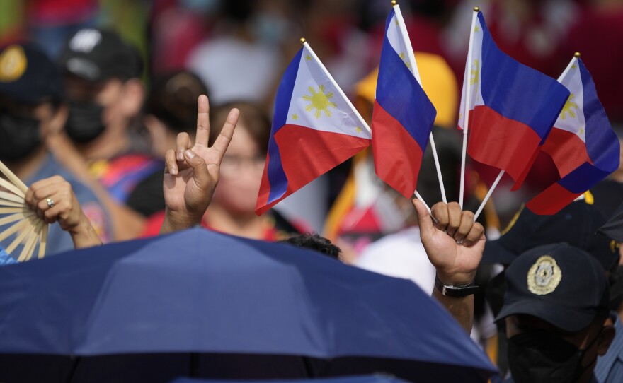 Supporters of President-elect Ferdinand "Bongbong" Marcos Jr. gather to wait for the inauguration ceremony Thursday, June 30, 2022 in Manila, Philippines.