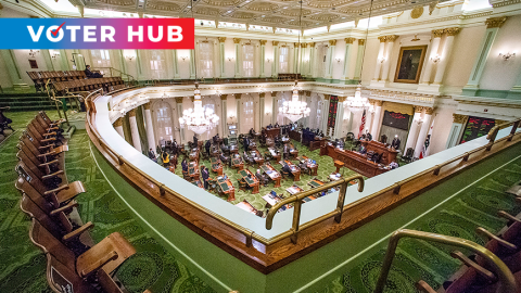 The State Assembly chambers are shown with the Voter Hub logo overlaid. 