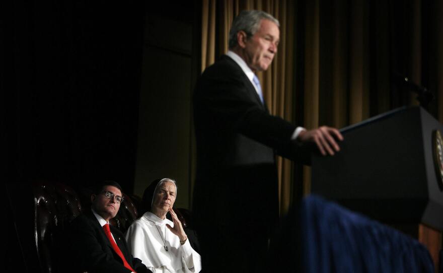 Leonard Leo (left) watches as then-President George W. Bush speaks at the National Catholic Prayer Breakfast in 2007.