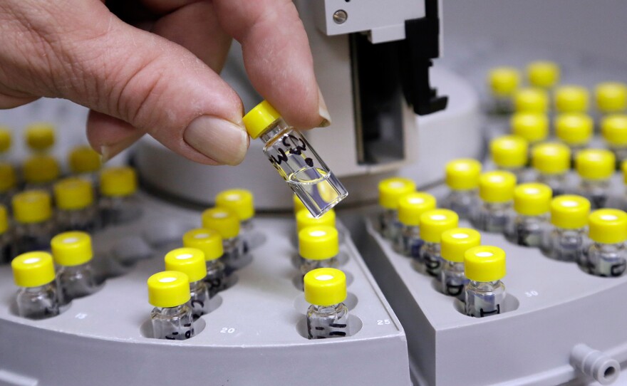 Vials are prepared to test medical marijuana at Sunrise Analytical lab in Wilsonville, Ore.