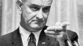 Lyndon B. Johnson delivers a speech 28 July 1965 in the White House in Washington, D.C.