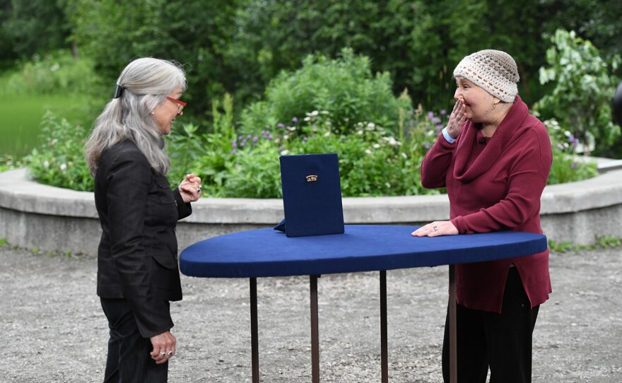 Sarah Churgin (left) appraises a Lucien Hirtz enamel and gold brooch, ca. 1910, in Anchorage, Alaska. ANTIQUES ROADSHOW “Alaska Native Heritage Center, Hour 2” premieres Monday, January 15 at 8/7C PM on PBS.