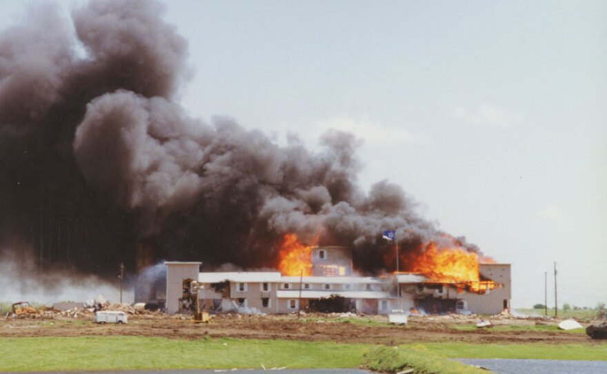 The Branch Davidian compound burning in Waco, Texas (April 1993).