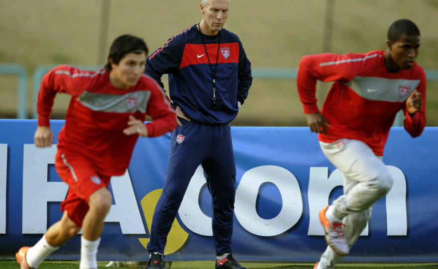 U.S. coach Bob Bradley watches over his players.