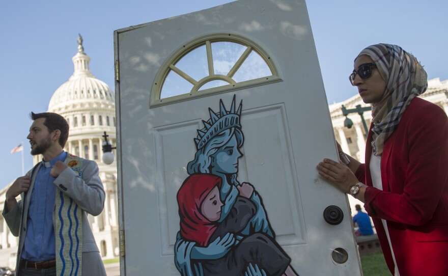 Religious leaders and activists from the Church World Service protest Wednesday, urging Congress to pressure President Trump to allow more refugees to enter the U.S.