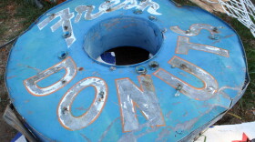 The original sign for Dude's Daylight Donuts had hung on Main Street in Joplin for decades. Here it sits in the public works yard.