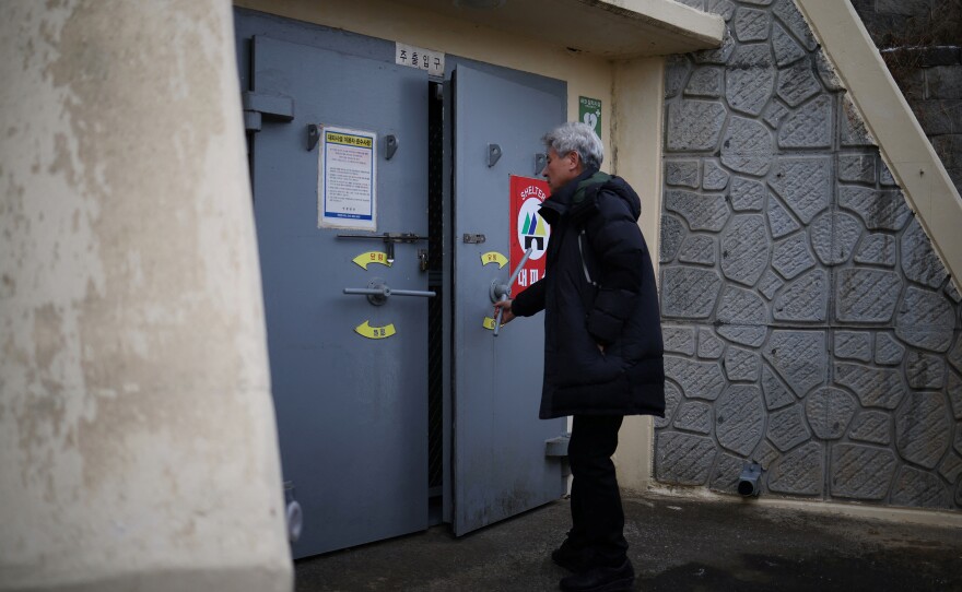 Kim Jeoung-hee, head of a residents community, opens up a shelter on Yeonpyeong Island, South Korea, on Jan. 8.